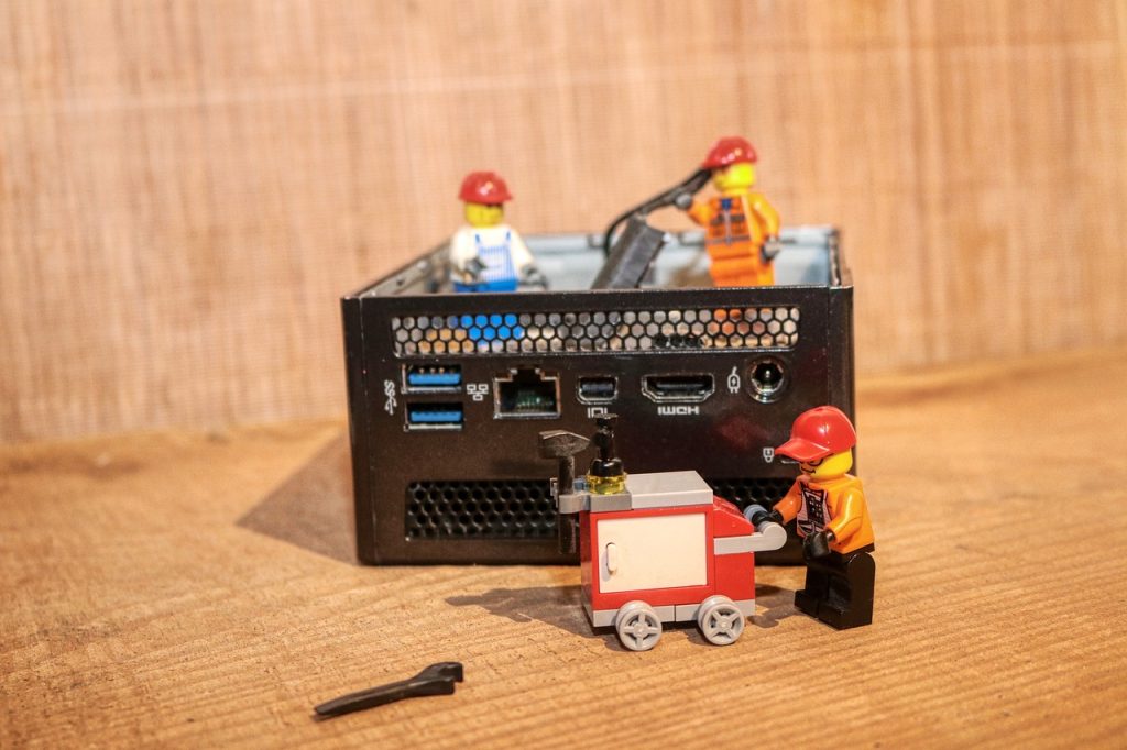 lego guys helping a broken computer